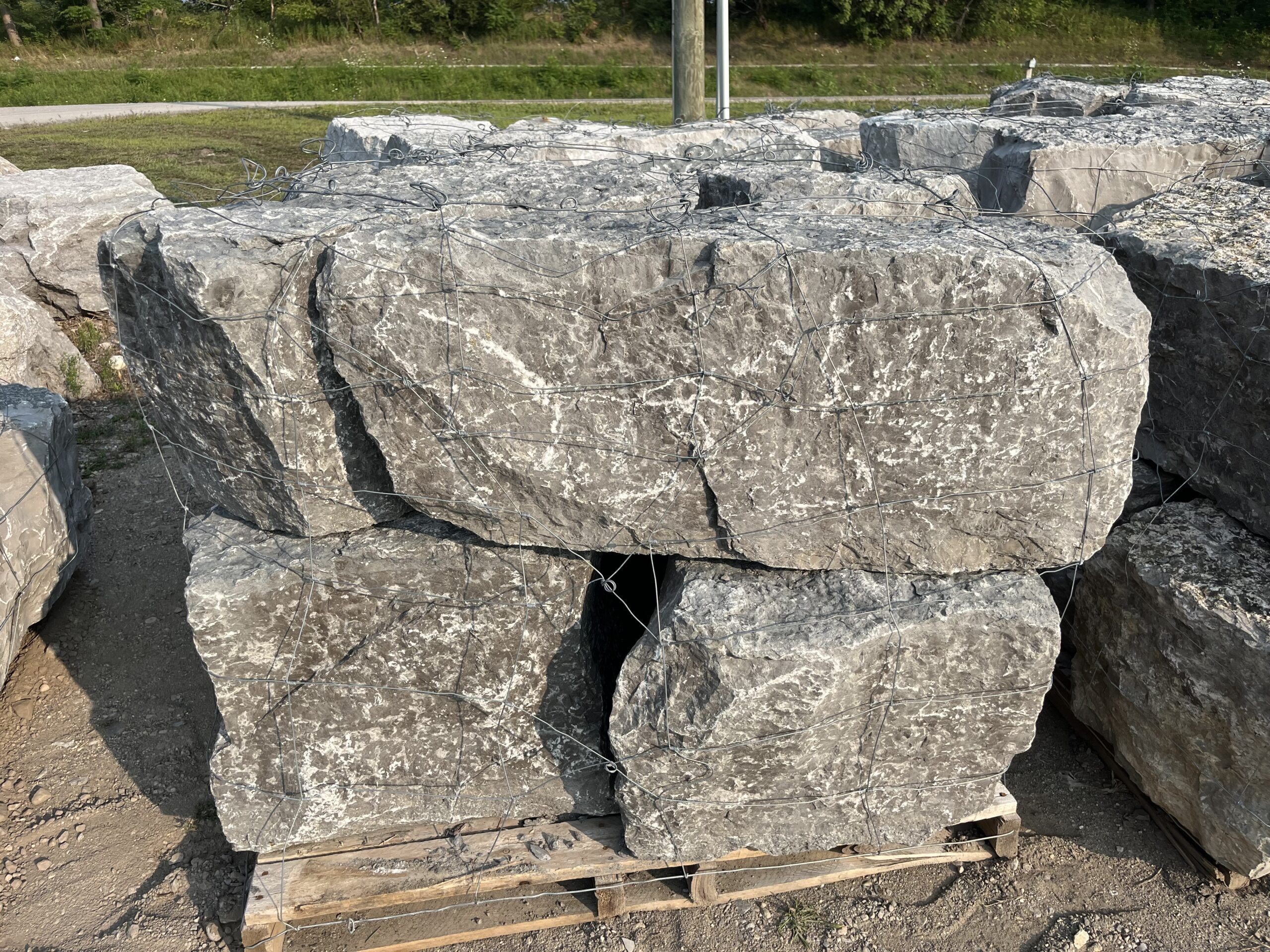 Grey armour stone. Used for retaining walls and decorative features in landscaping.. Gray armor stone